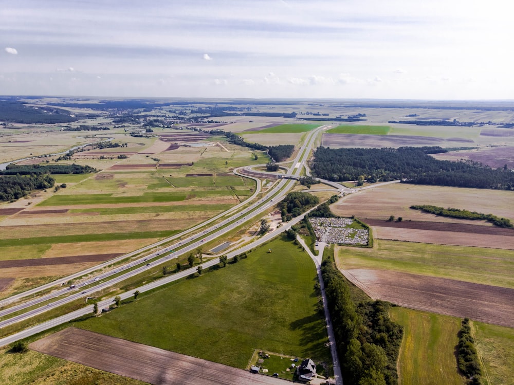 an aerial view of a highway in the country
