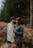 man and woman kissing on brown grass field during daytime