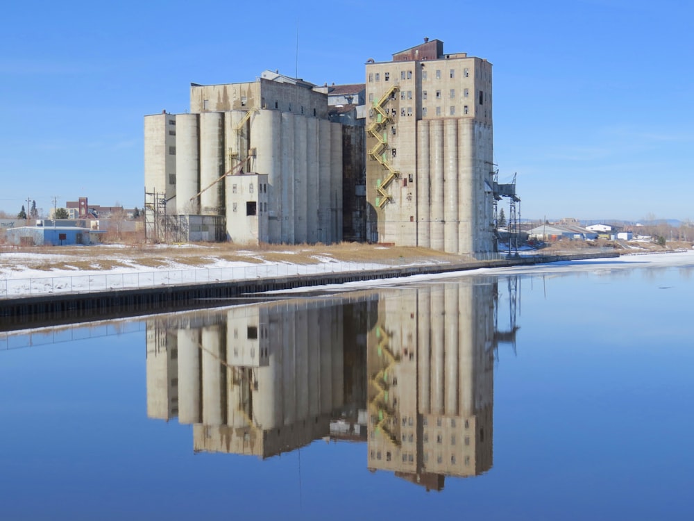 a large building sitting next to a body of water