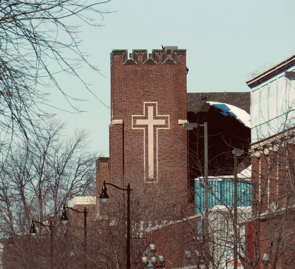 brown concrete building near bare trees during daytime