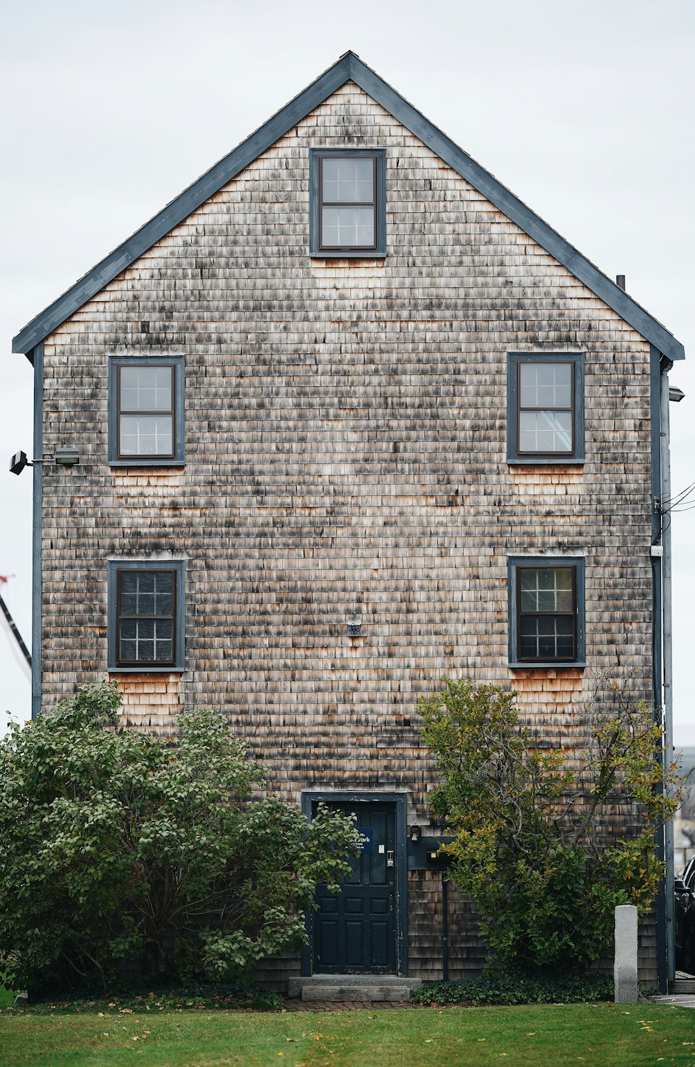 brown brick building with green trees