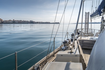 white and brown boat on sea during daytime
