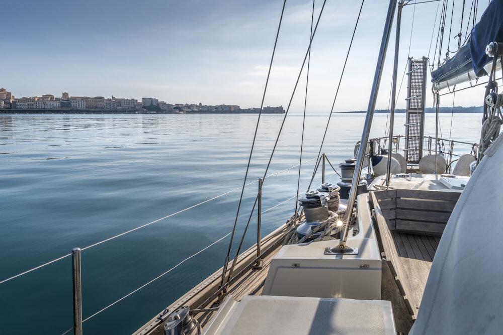 white and brown boat on sea during daytime