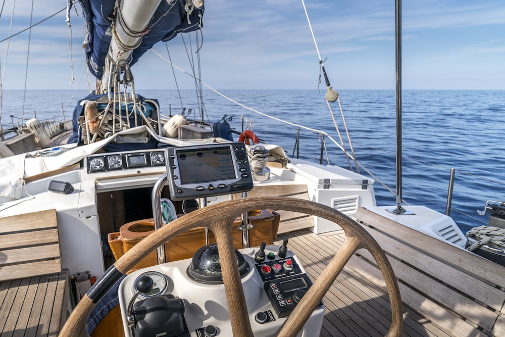 white and brown boat on sea during daytime