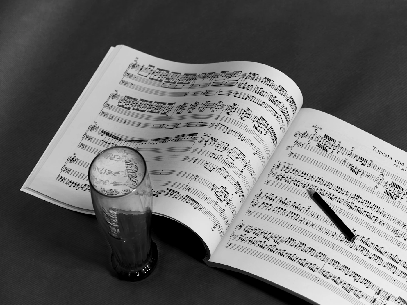 Annotated musical score on a dark table
