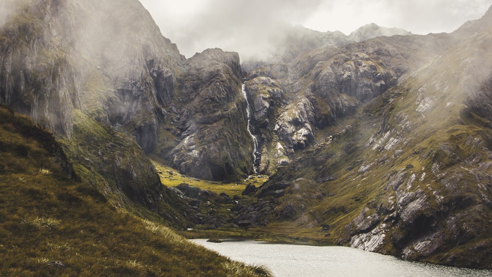 green and gray mountains under white sky during daytime