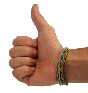 Close-up of a client giving a thumbs-up during a virtual meeting with Palen Solutions consultants