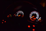 Close shot of a race car dashboard showing speed and lap times