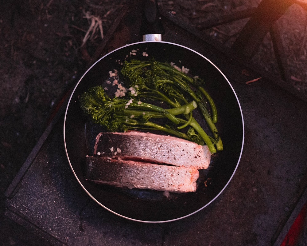 sliced meat on black frying pan