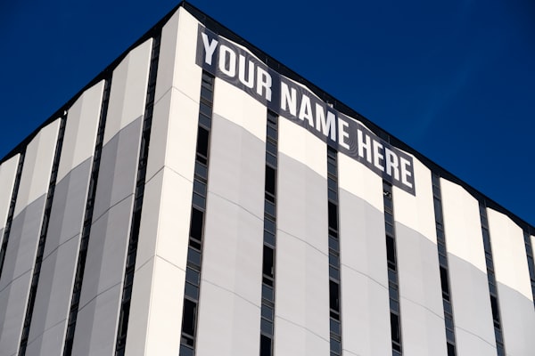 'Your Name Here' Sign on the Side of a Building