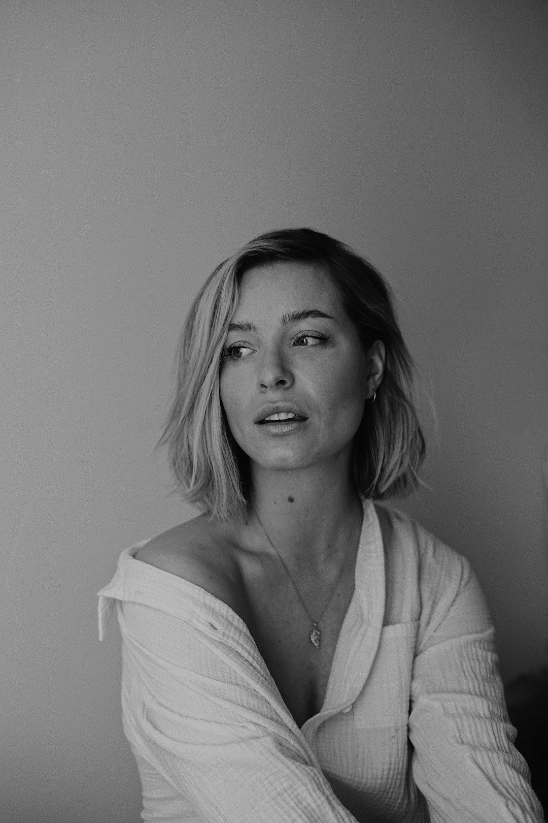 woman in white cardigan and white shirt