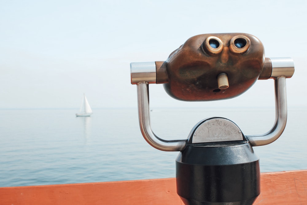 black and silver coin operated binoculars