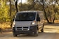 white and black mercedes benz van parked on gray concrete road during daytime