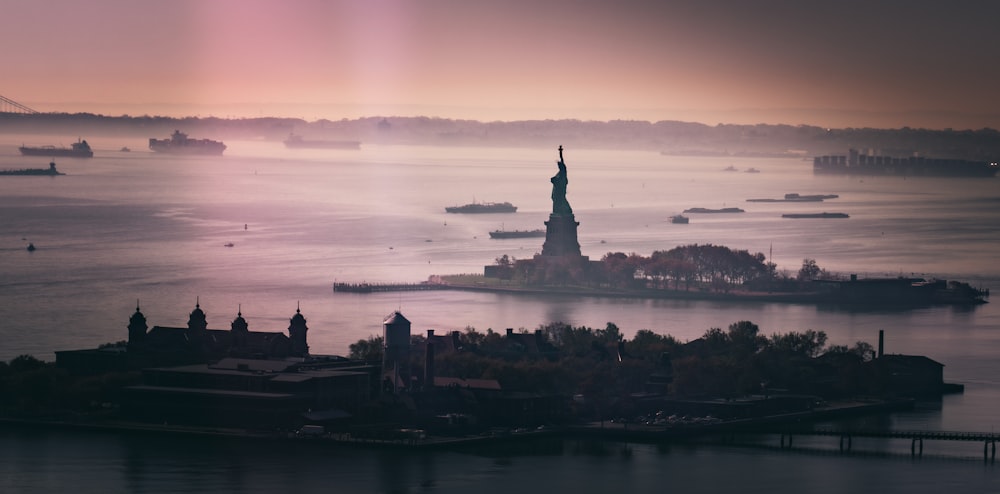 silhouette of statue of liberty during sunset