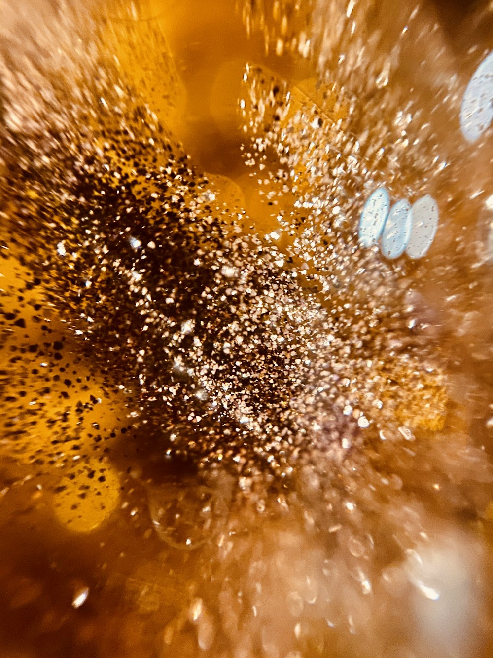 water droplets on brown wooden surface
