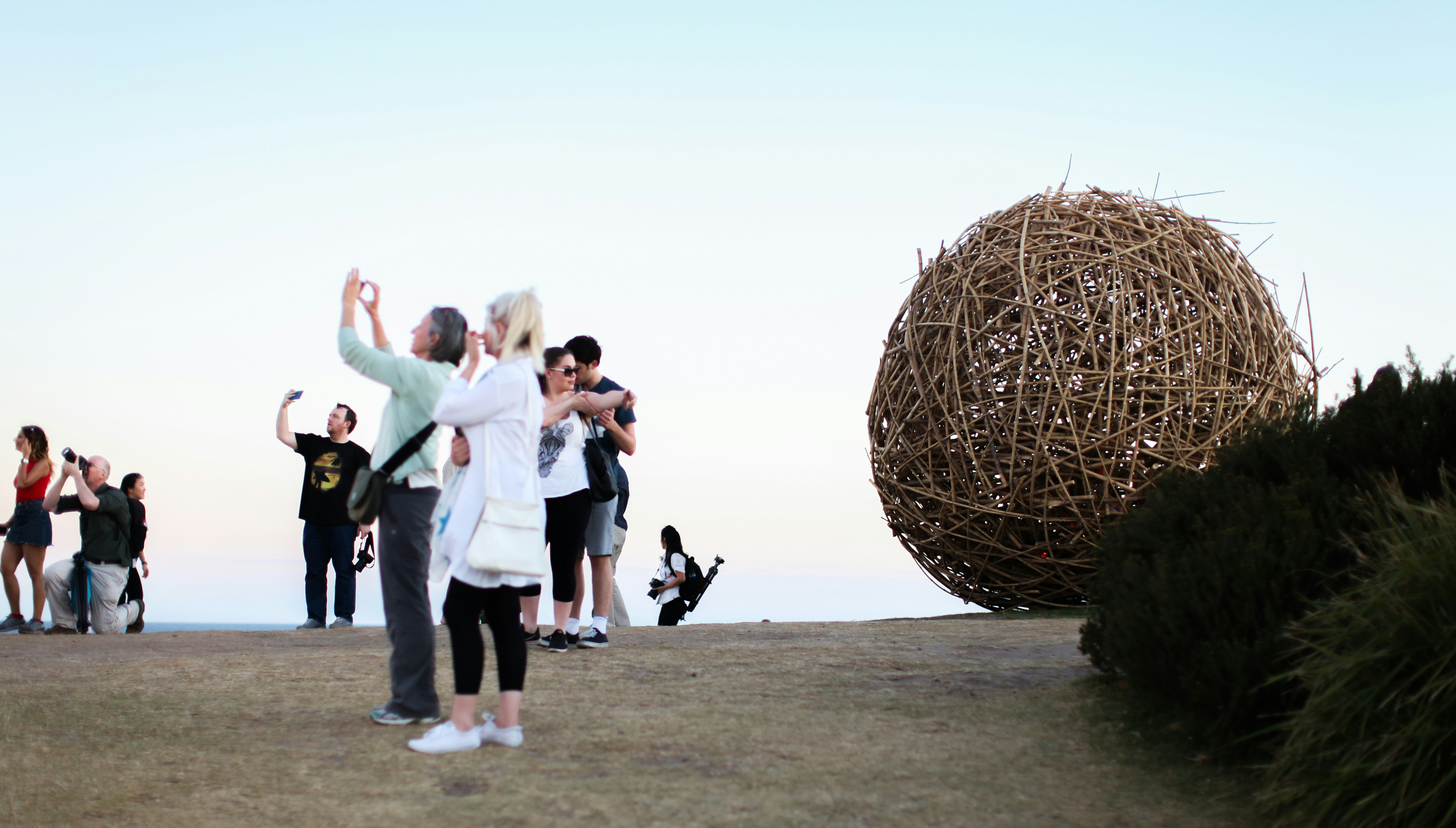 people walking on gray sand during daytime