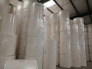 Stacks of high-quality paper rolls ready for large-scale digital printing