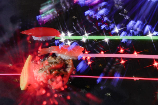 Artistic shot of glowing magenta and cyan neon reflections on fresh sushi pieces.
