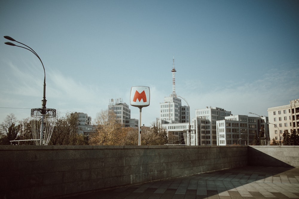 a large mcdonald's sign in front of a cityscape