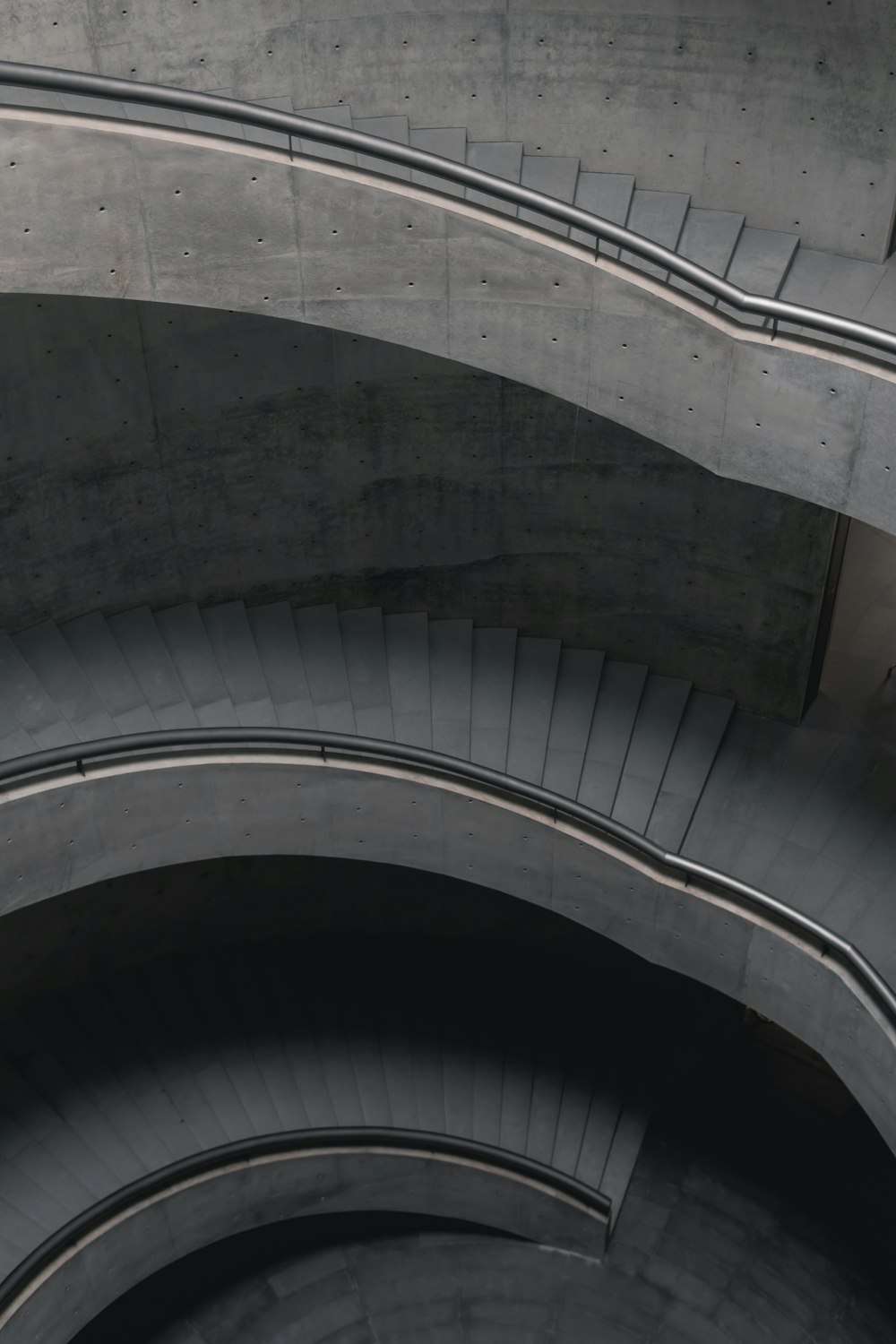 gray concrete spiral staircase during daytime