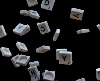 white and black letter t-letter blocks