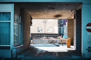 A sleek automatic boom barrier with RFID installed at a parking entrance.