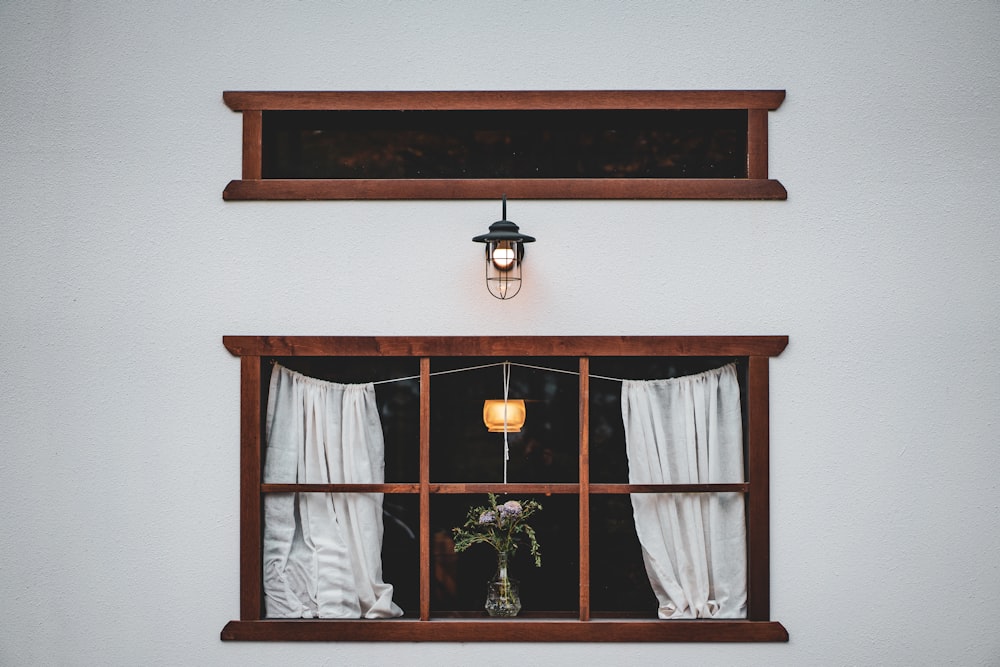 brown wooden framed glass window