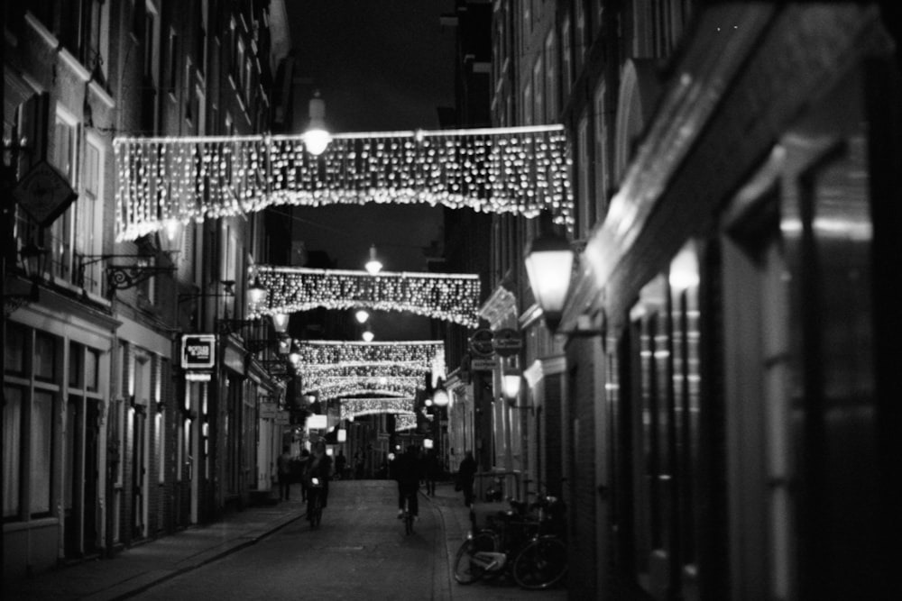 grayscale photo of people walking on street