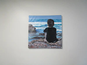 A hand-painted digital illustration of a thoughtful learner gazing out a window, surrounded by flowing blue and orange brushstrokes symbolizing knowledge and connection.