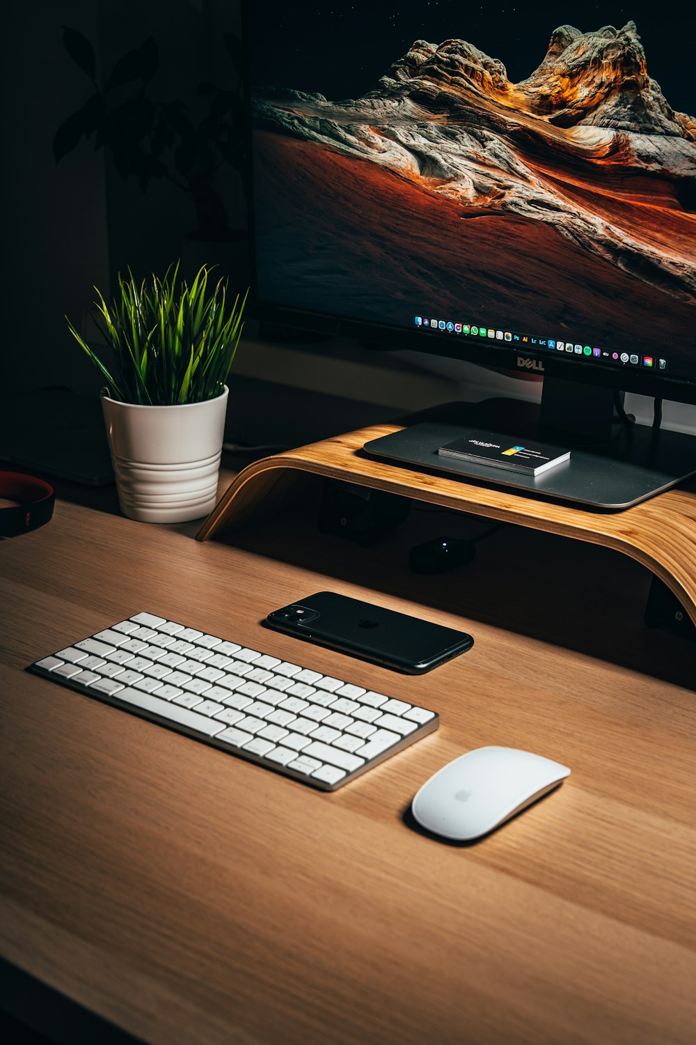 black samsung flat screen computer monitor beside white apple keyboard