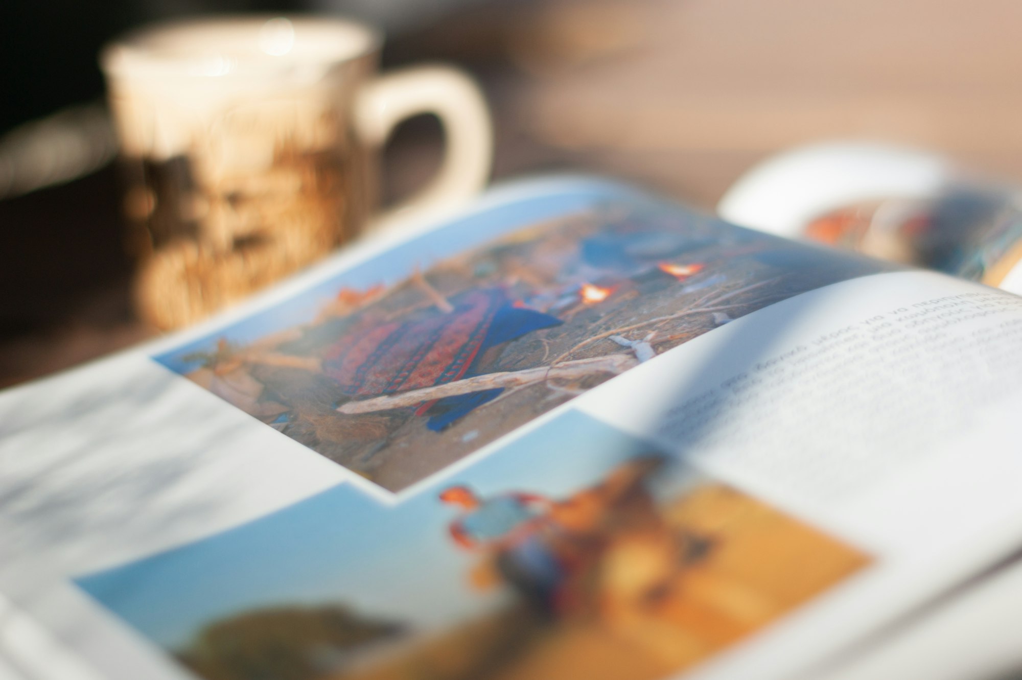 The pleasure of coffee drinking while reading a travel book.