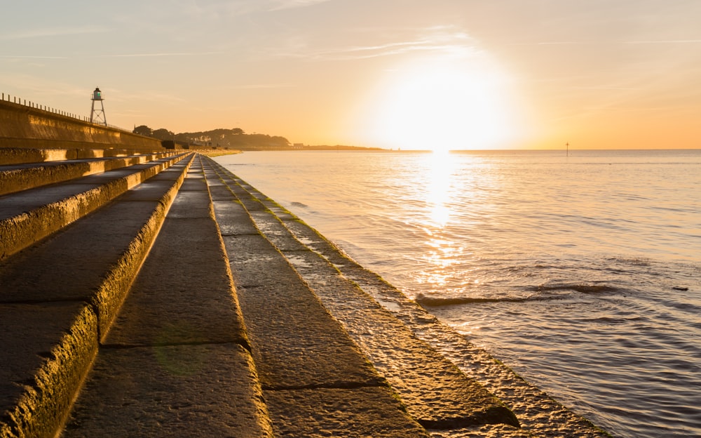 brown wooden dock on sea during daytime