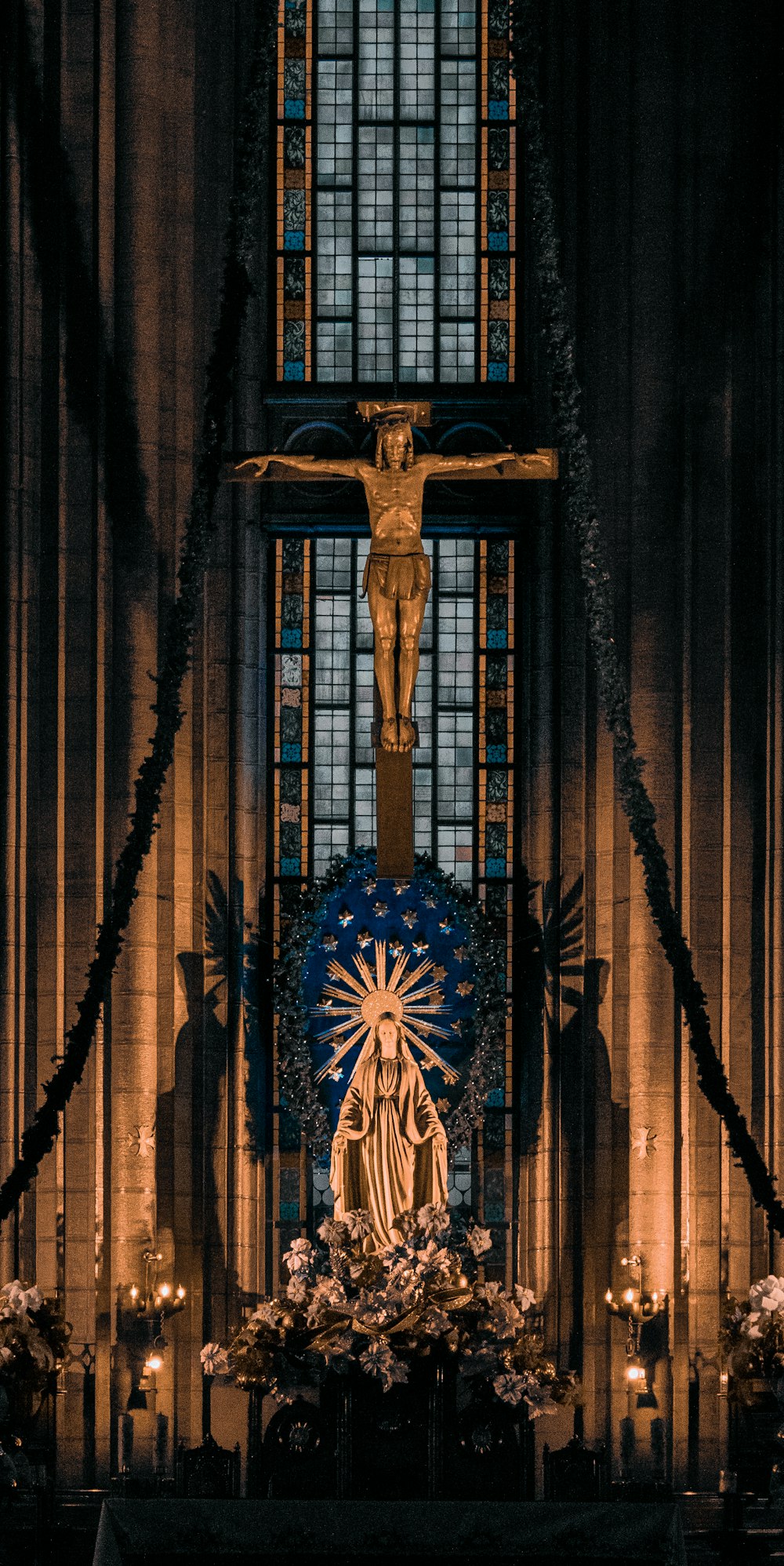 gold cross on brown wooden door