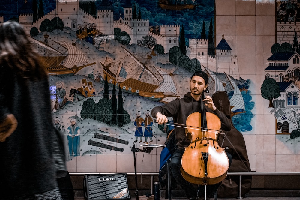 man playing violin on street