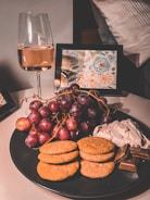 An elegant arrangement of gourmet snacks and wine glasses.