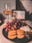 Elegant close-up of a premium ham and wine pairing on a black and gold table setting.