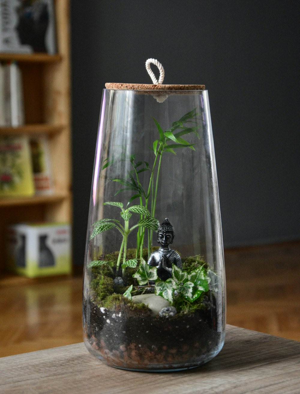 clear glass bottle with green plant