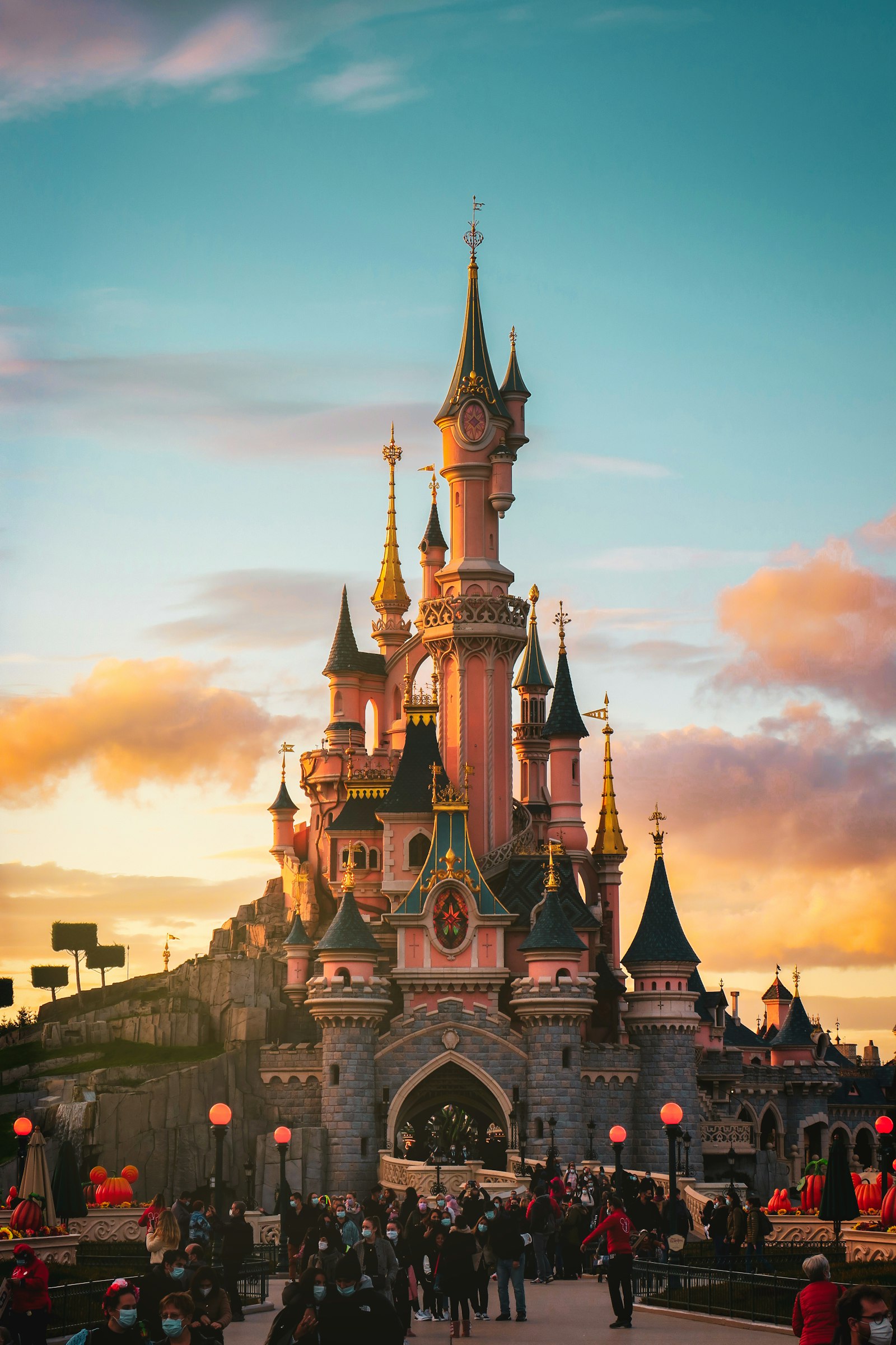 Disney castle silhouette over Walt Disney World skyline at dusk