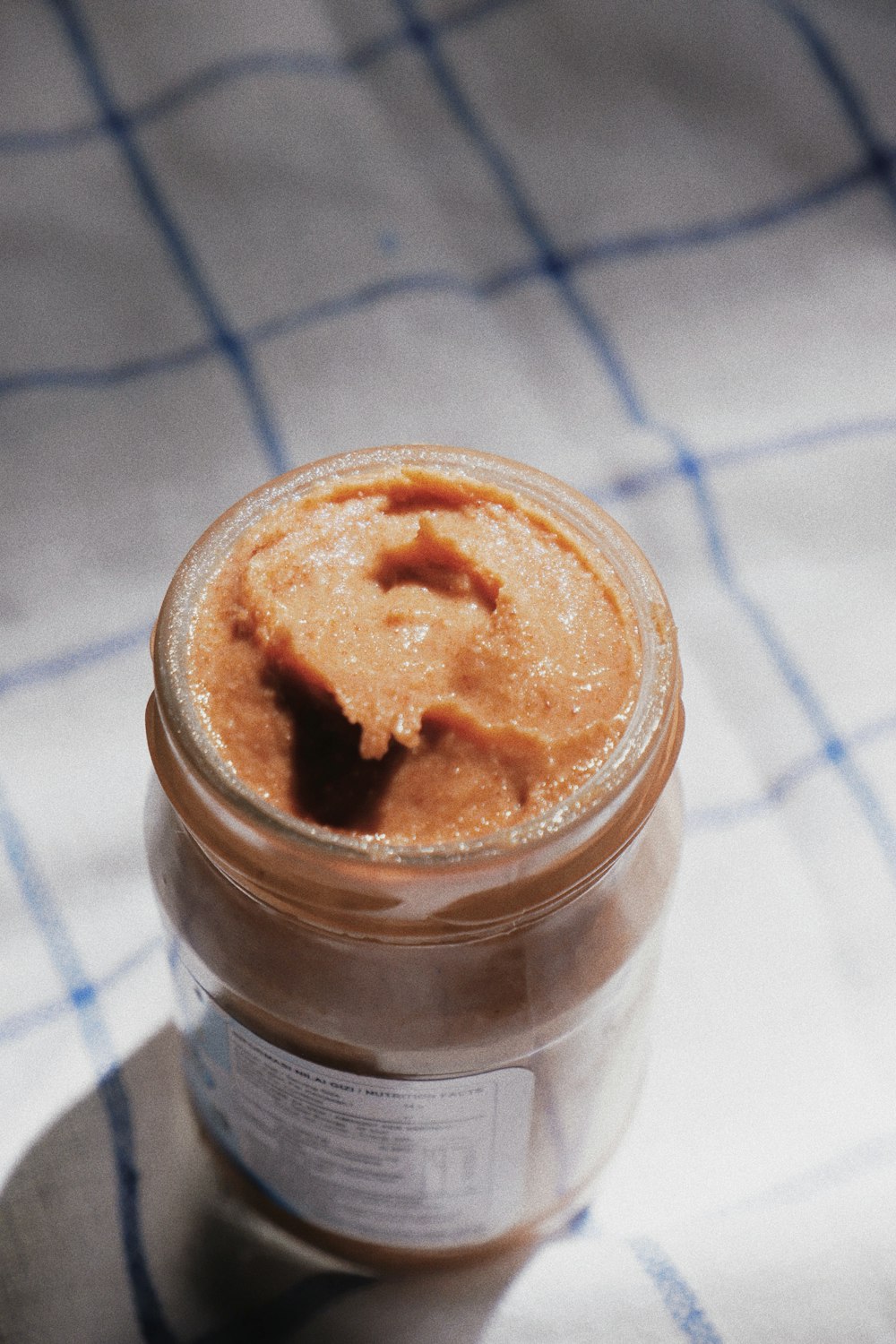 brown powder in clear glass jar