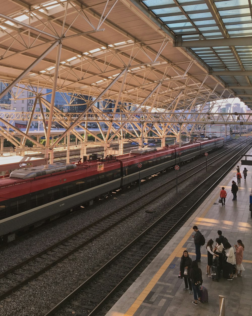 people walking on train station during daytime