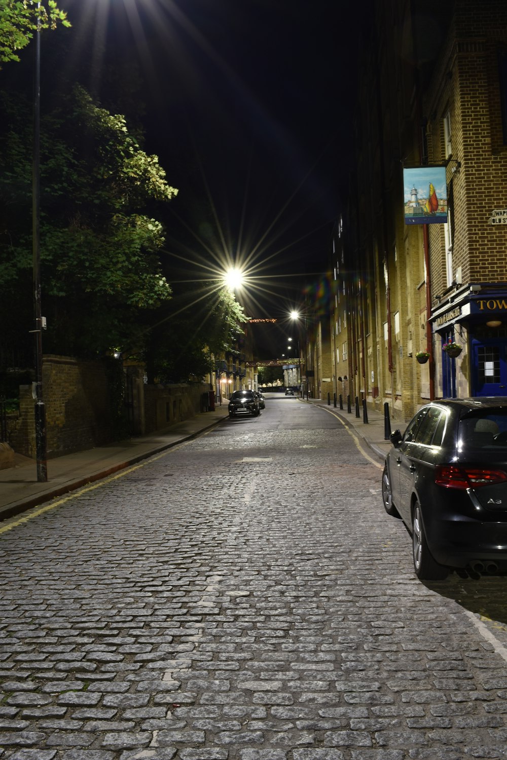 black car on road during night time