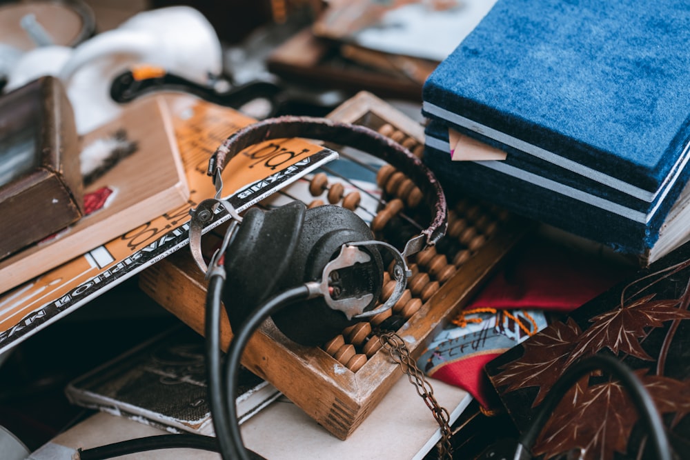 black and brown corded headphones on brown wooden table