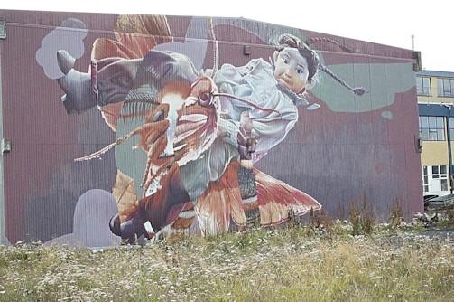 A creative mural painted on a building wall promoting mahi fabrion’s latest campaign.