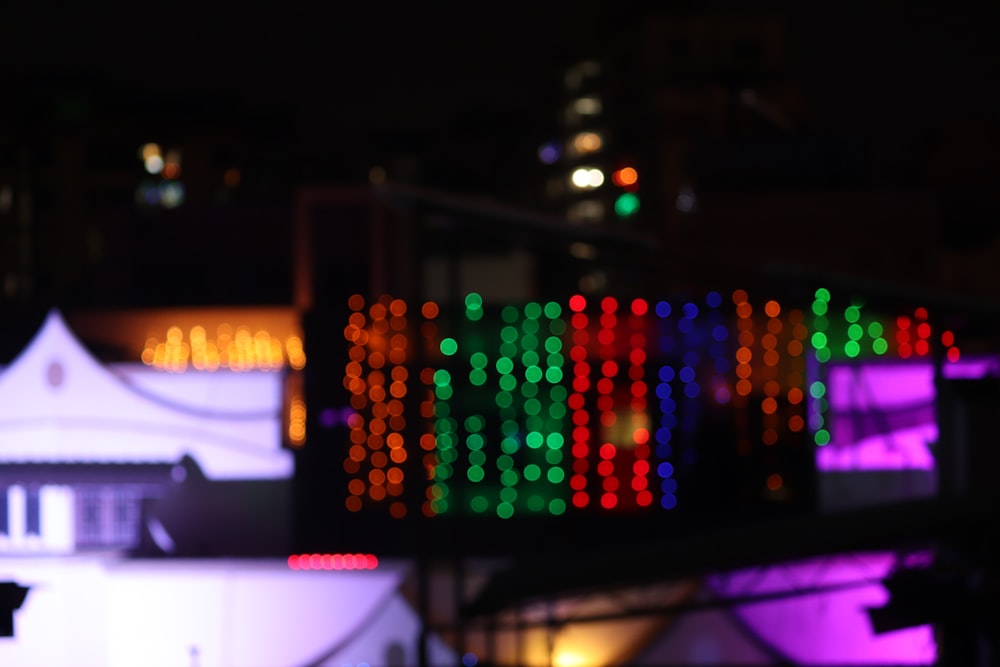 green and yellow lights on a building