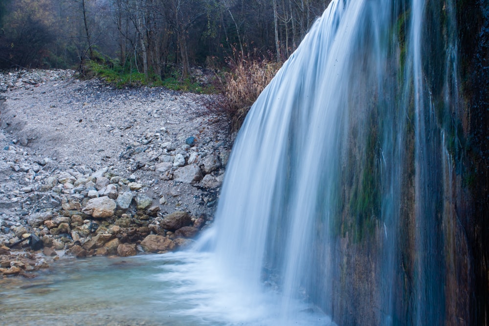 water falls on rocky ground