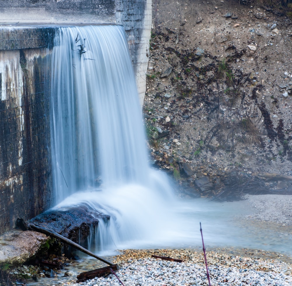 water falls on rocky ground