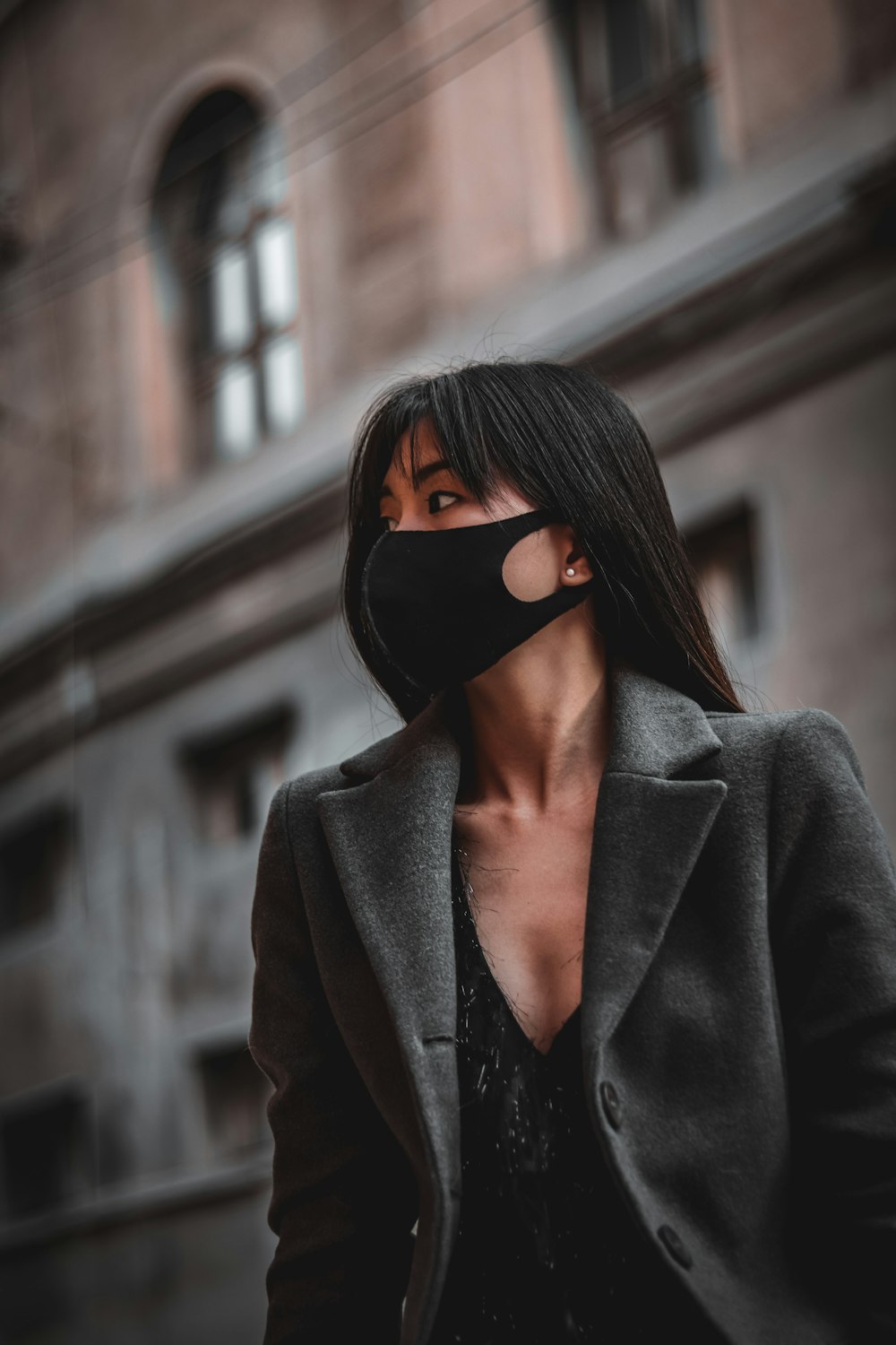 woman in black sunglasses and gray coat