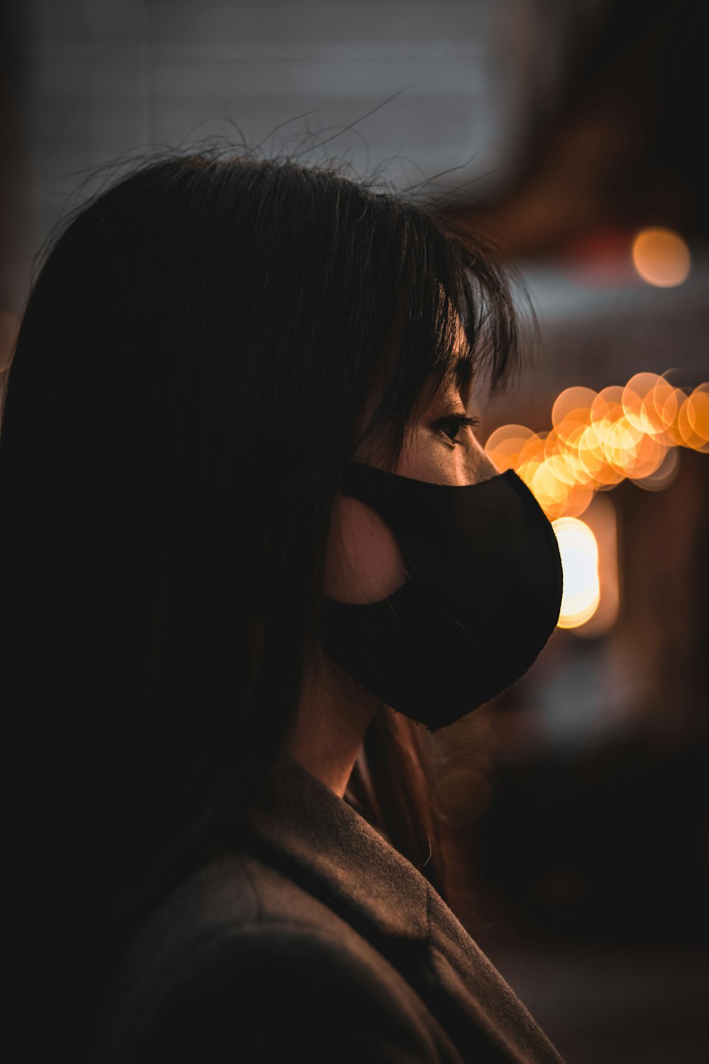 woman in black sunglasses holding yellow lights