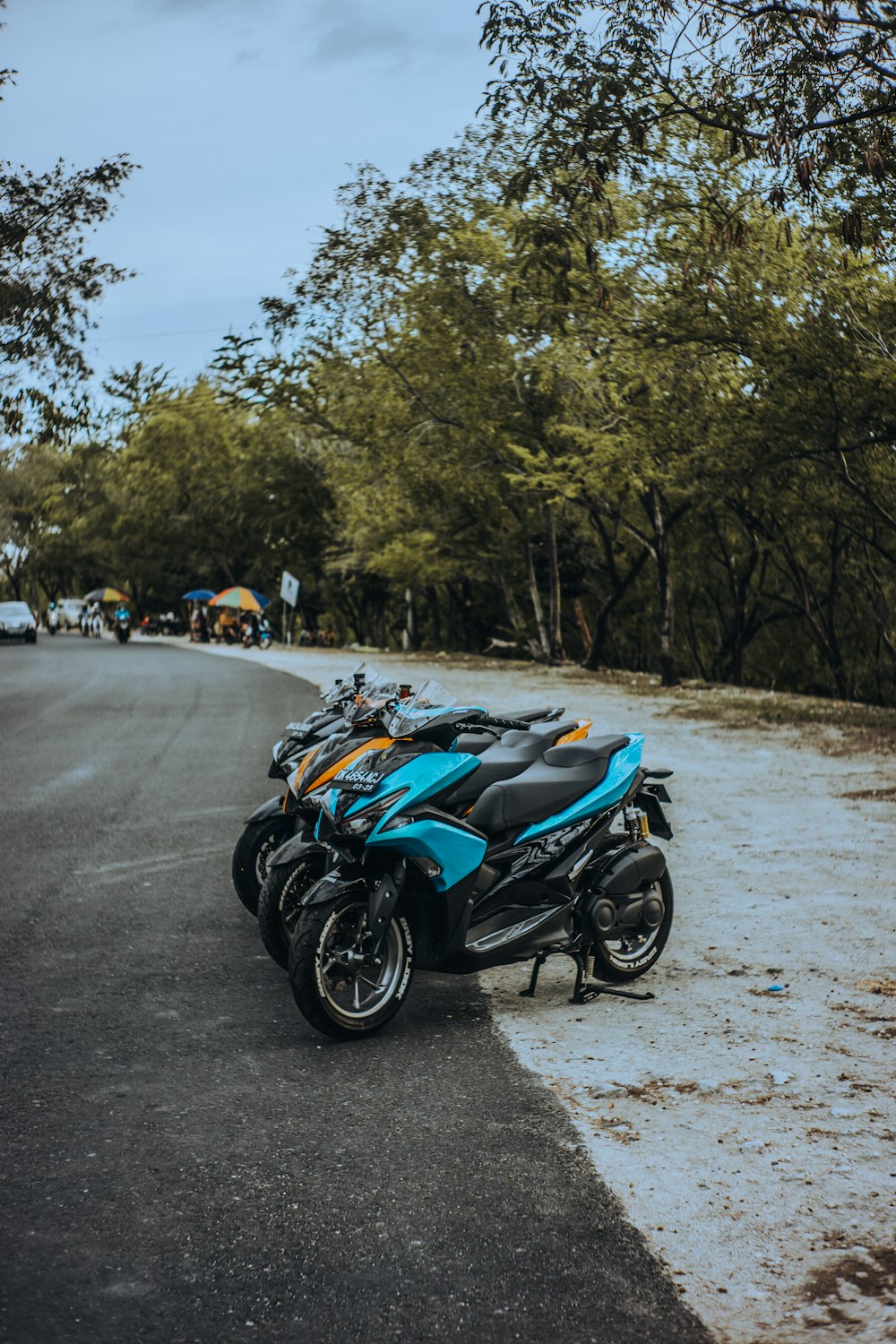 blue and black sports bike on road during daytime