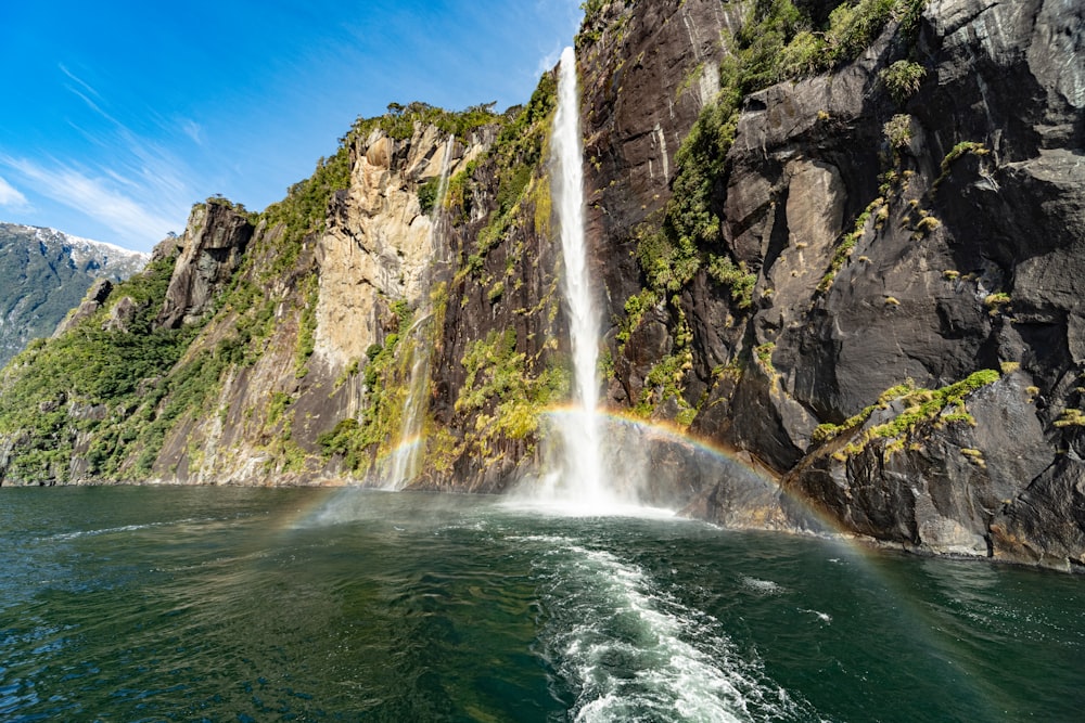 waterfalls on rocky mountain during daytime